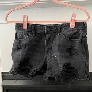 Distressed black denim shorts